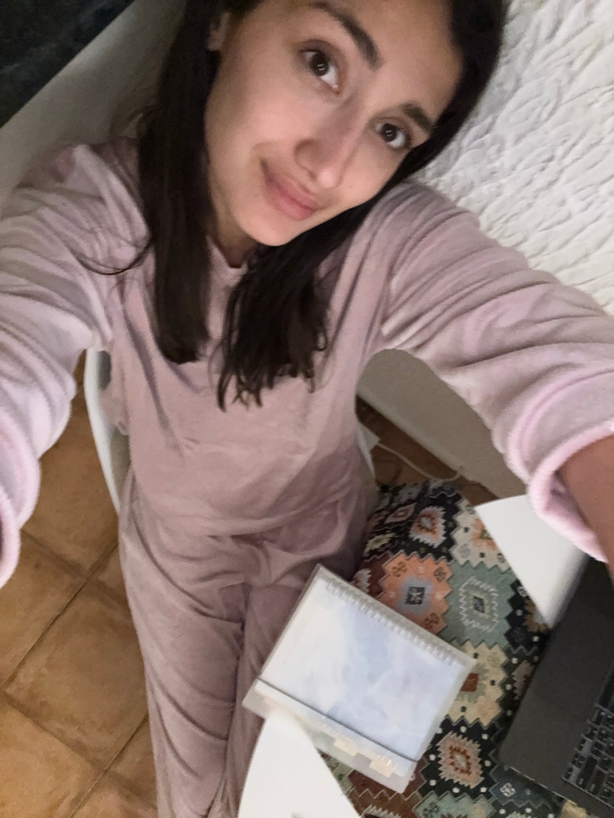Woman takes relaxed selfie indoors in Sutomore, Montenegro
