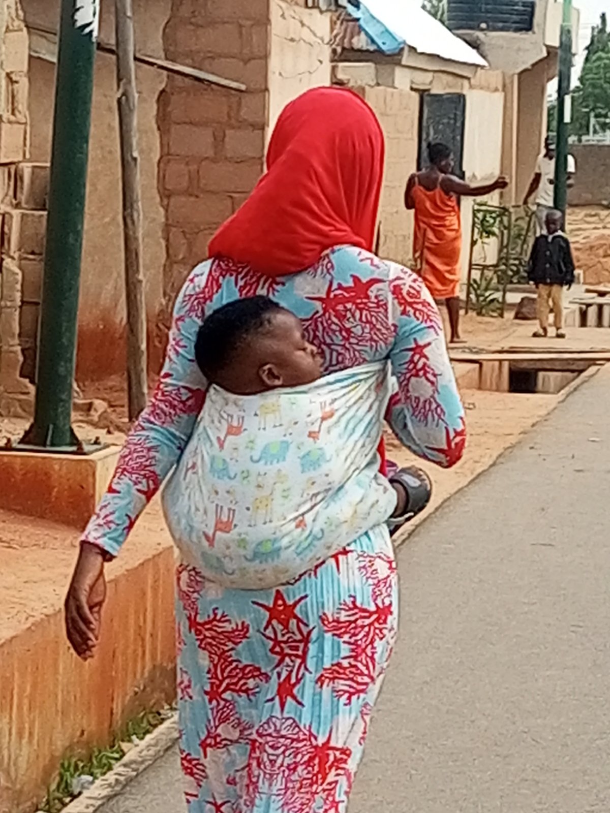 Women go about daily routines in Pantame, Nigeria