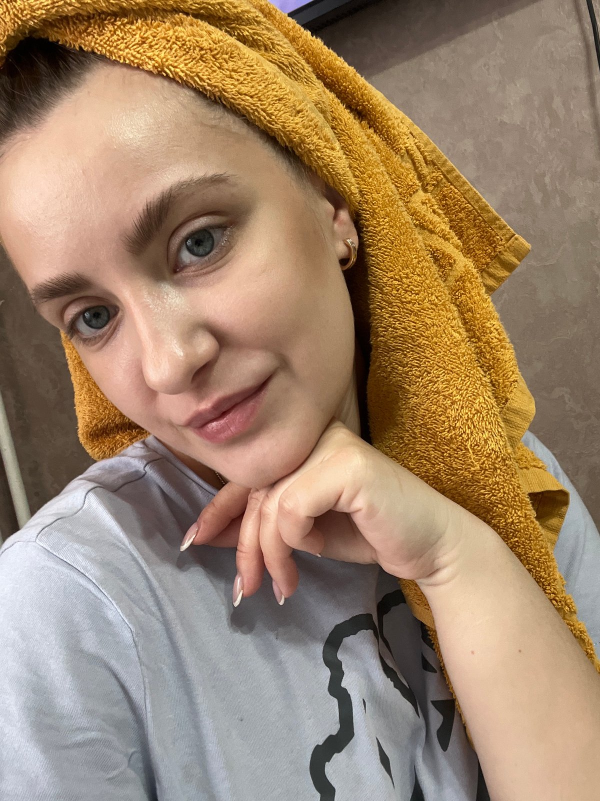 Woman resting with orange towel observed in Марковский, Russia