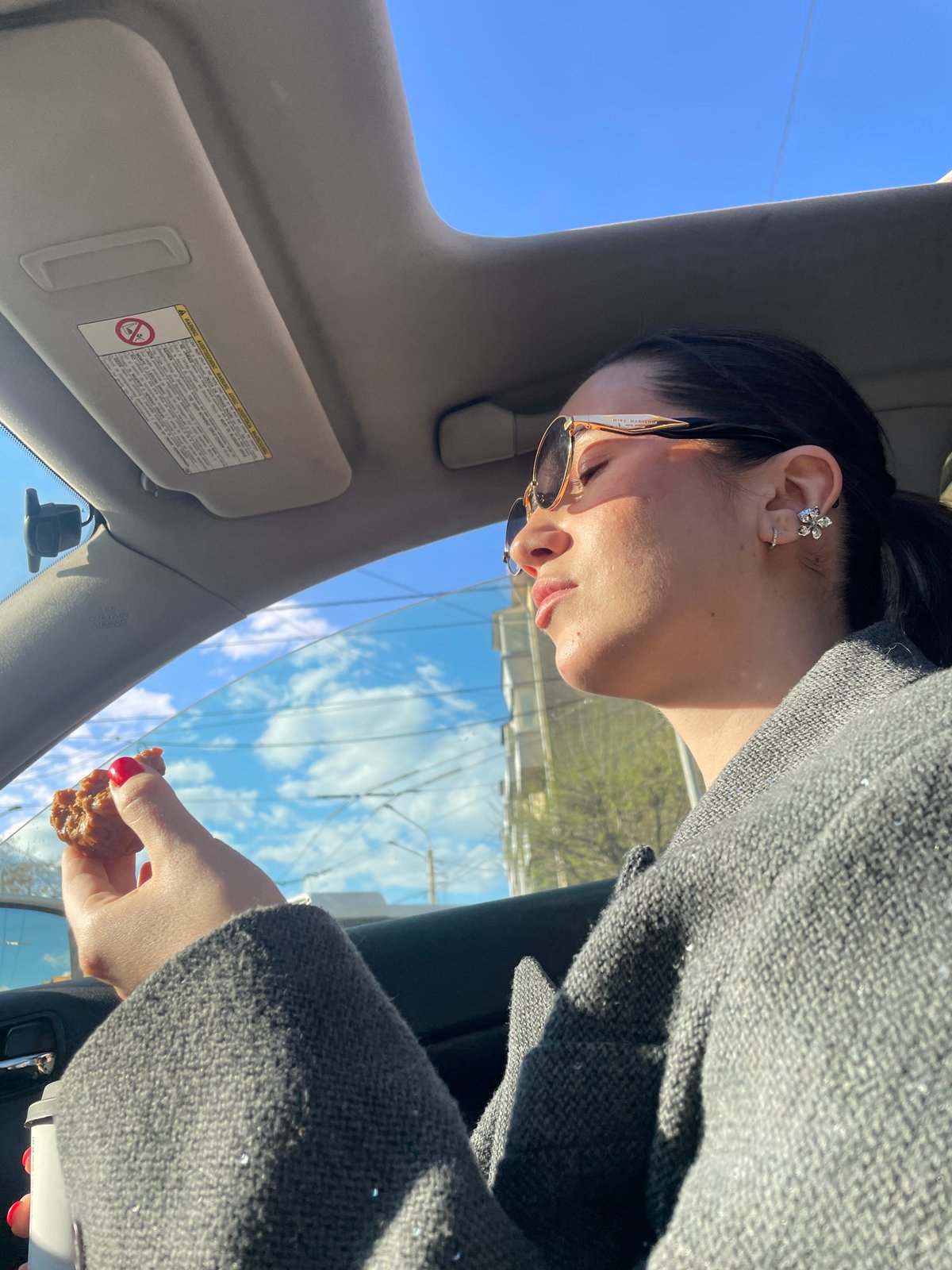Person eats food in car in Krasnoyarsk