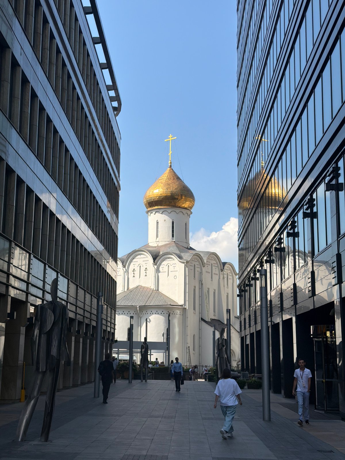 Moscow street life: sculptures, dancing, and a parked bicycle