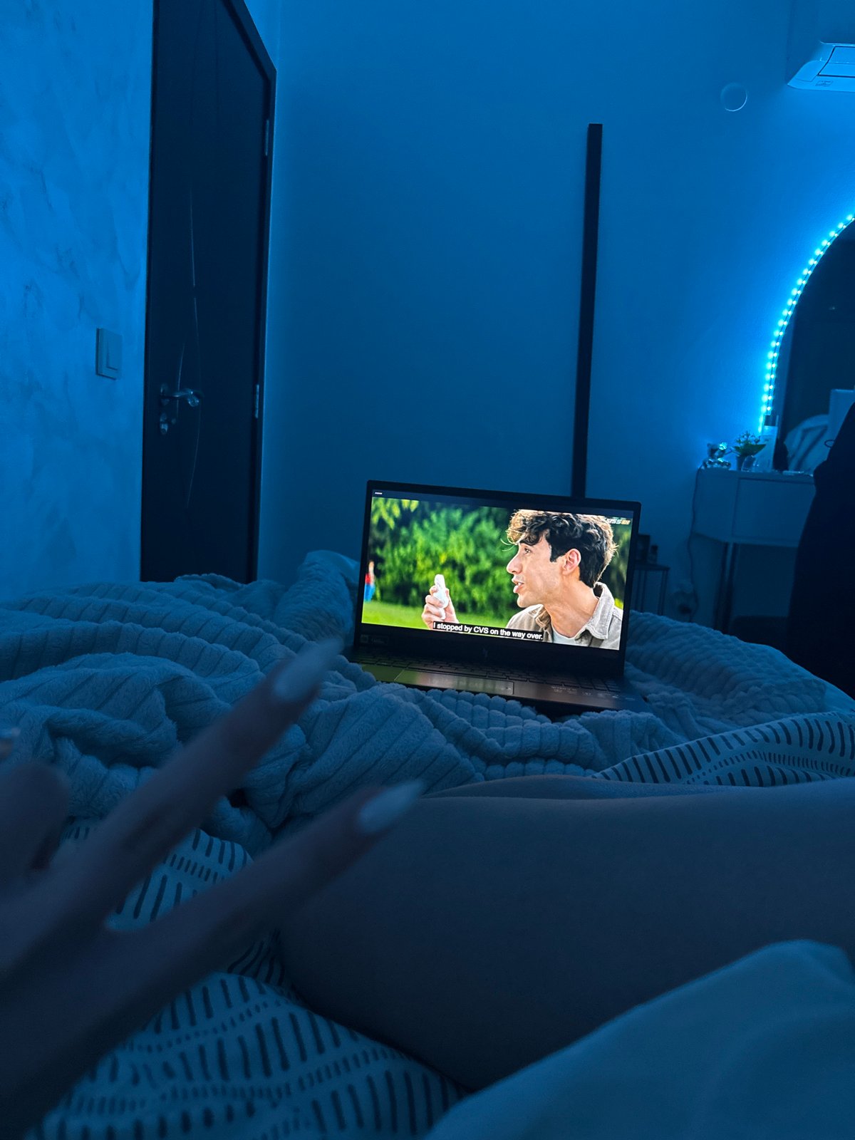 Person watches laptop movies in bed in Blagoevgrad