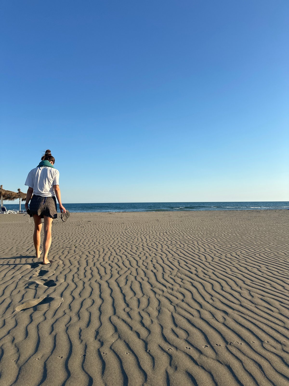 Quiet afternoon on a dark sand beach in Montenegro