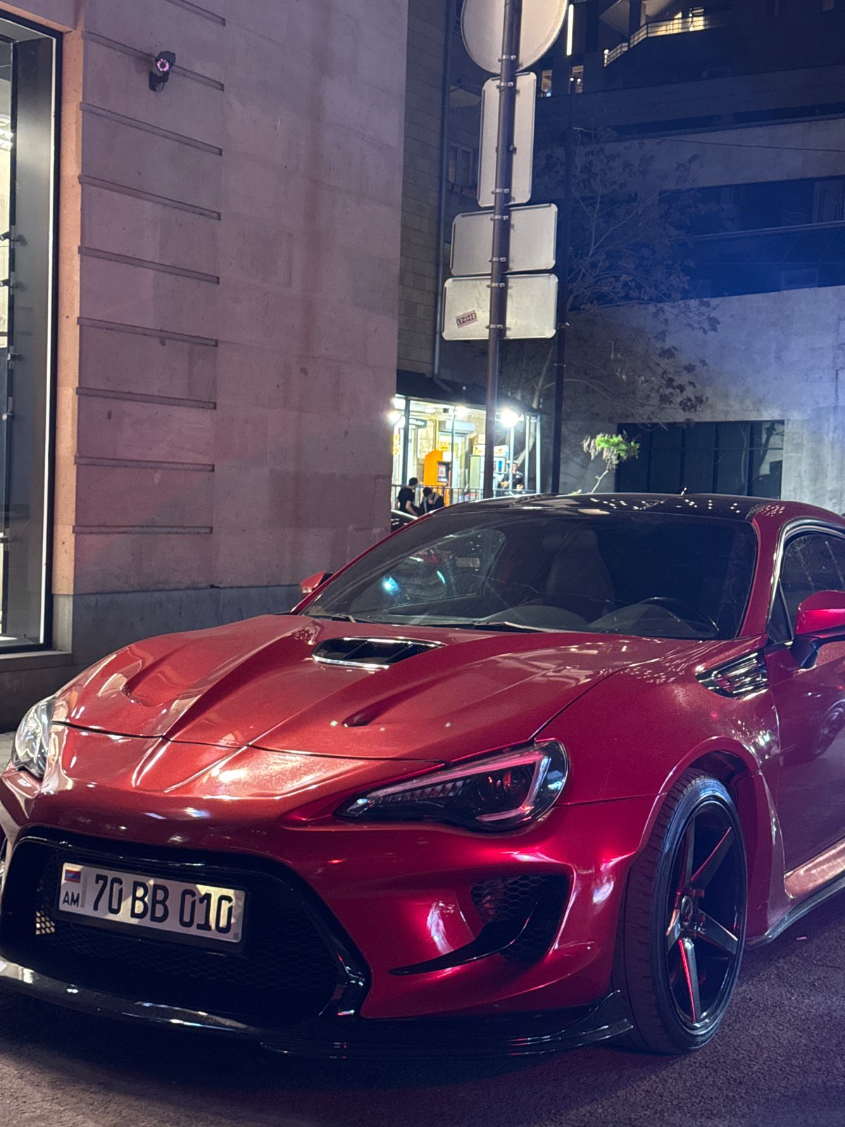 Red sports car spotted near construction zone in Yerevan