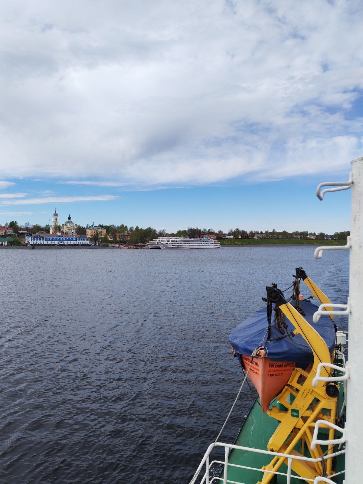 River passenger documents Myshkin cityscape from Volga waters