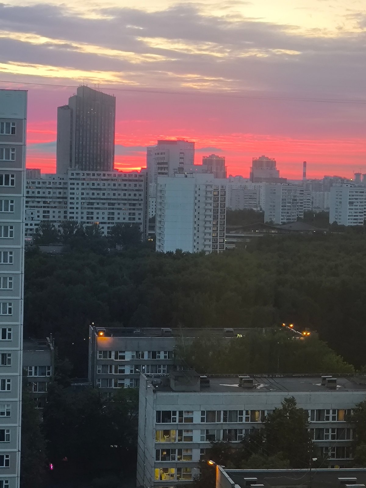 Moscow skyline glows under a fiery summer sunset