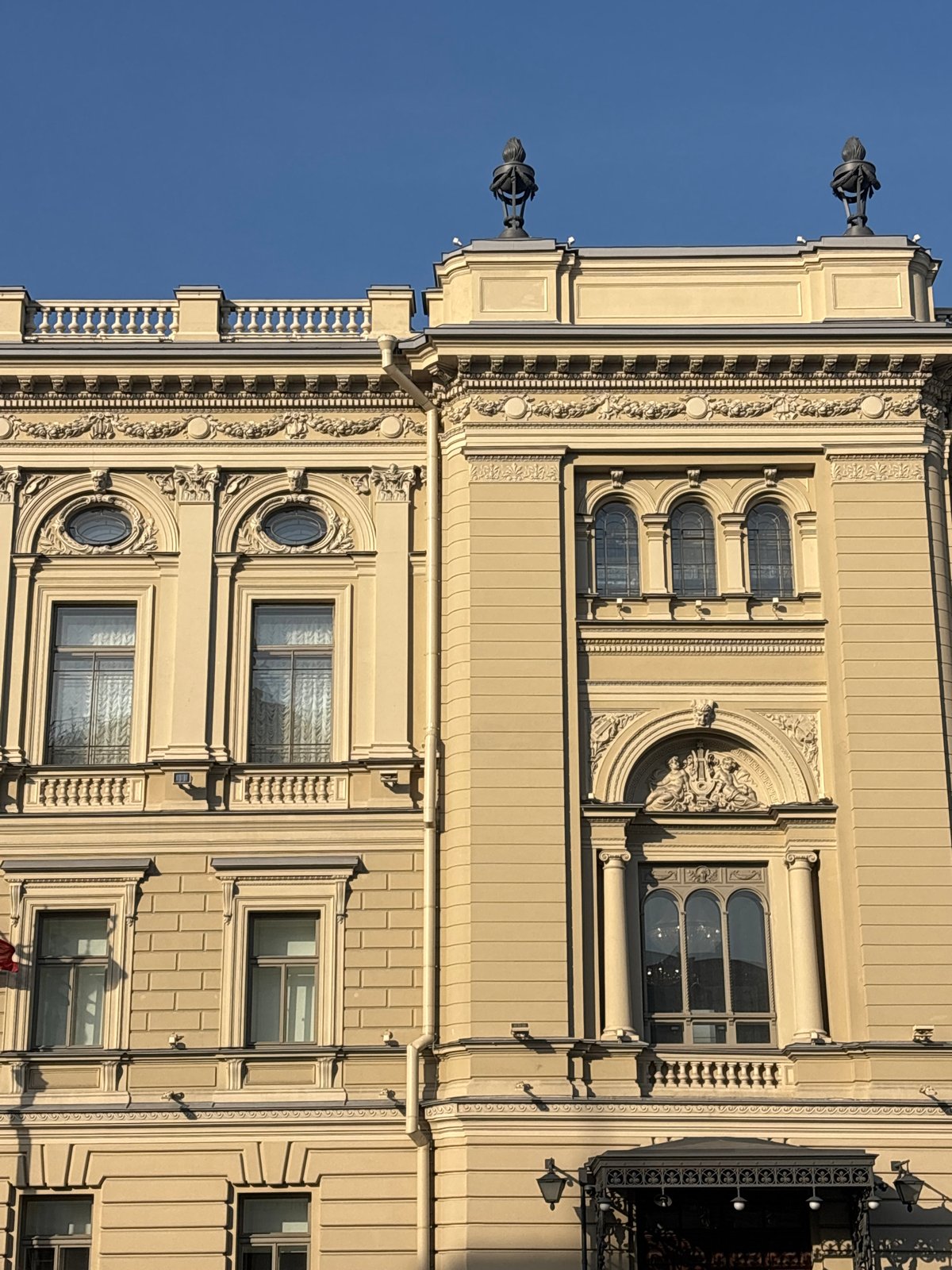 Tourist documents Saint Petersburg architecture and cafe during afternoon stroll