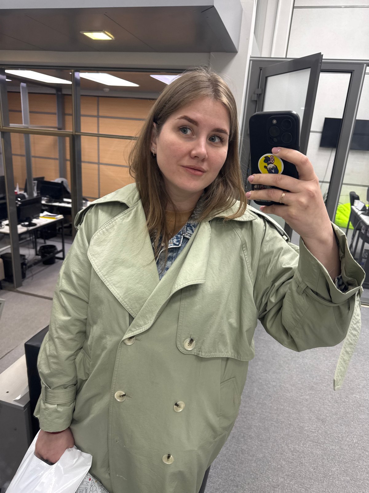 Woman takes selfie in building in Perm, Russia