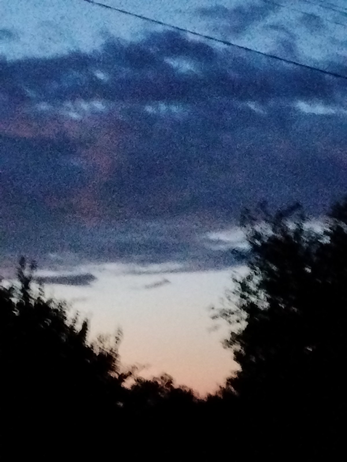 Dusk settling over rural Ustyvytsia, Ukraine