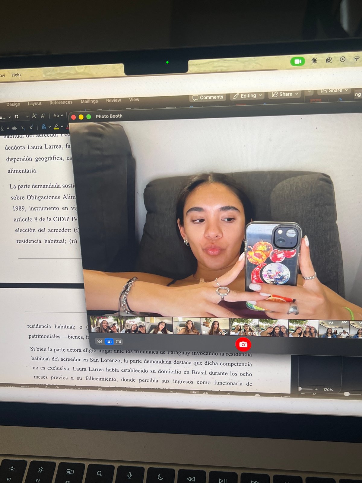 Student studies international law documents on devices in Mexico