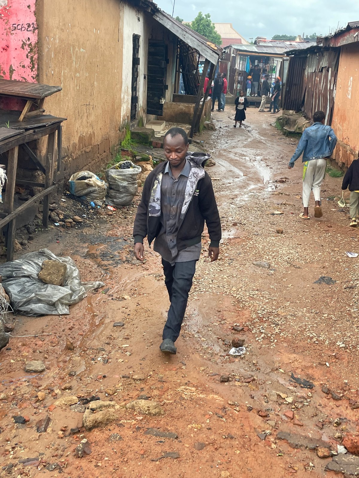 Wet streets and everyday errands in Jos, Nigeria