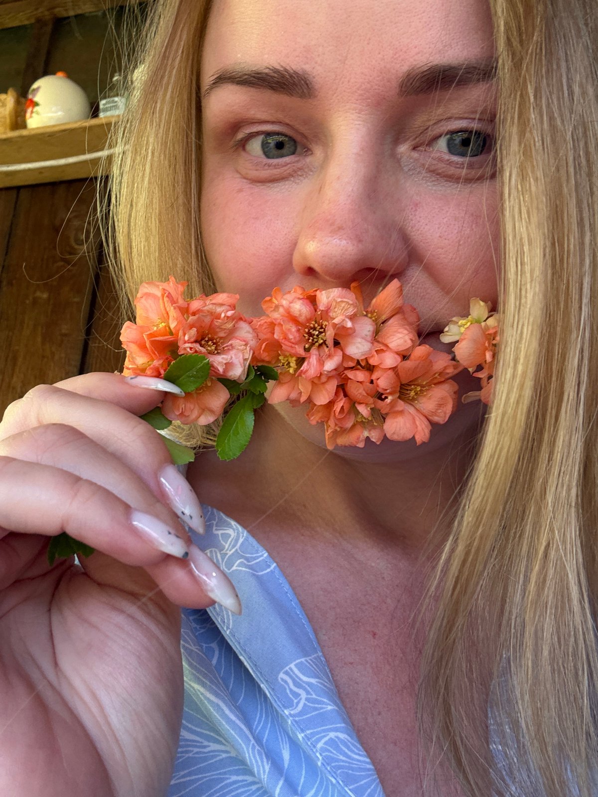 Woman photographed with orange flowers in Chaikovsky, Russia