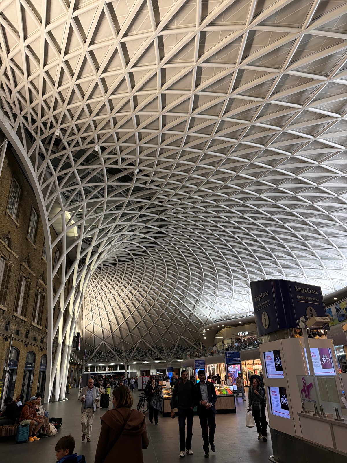 Evening architectural documentation at London's King's Cross and St. Pancras stations