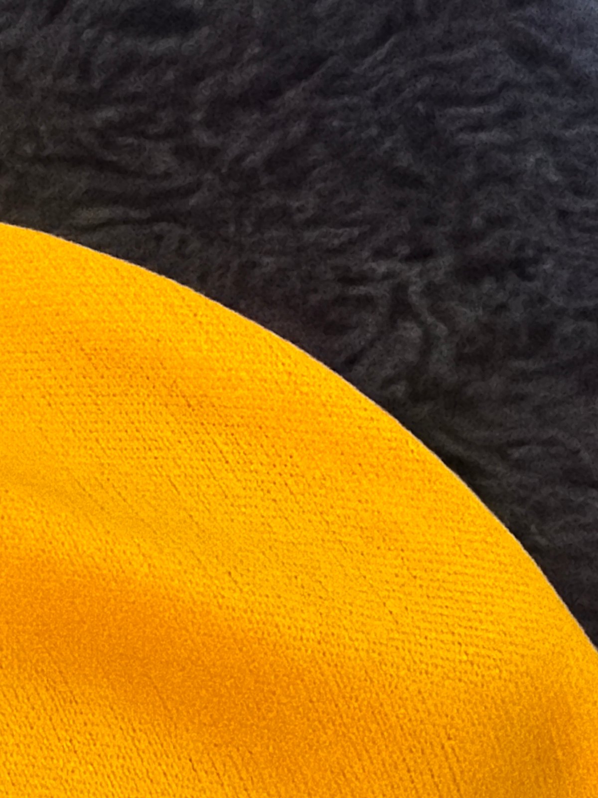 Scattered close-ups of fabrics, a phone, and digital art in Rome