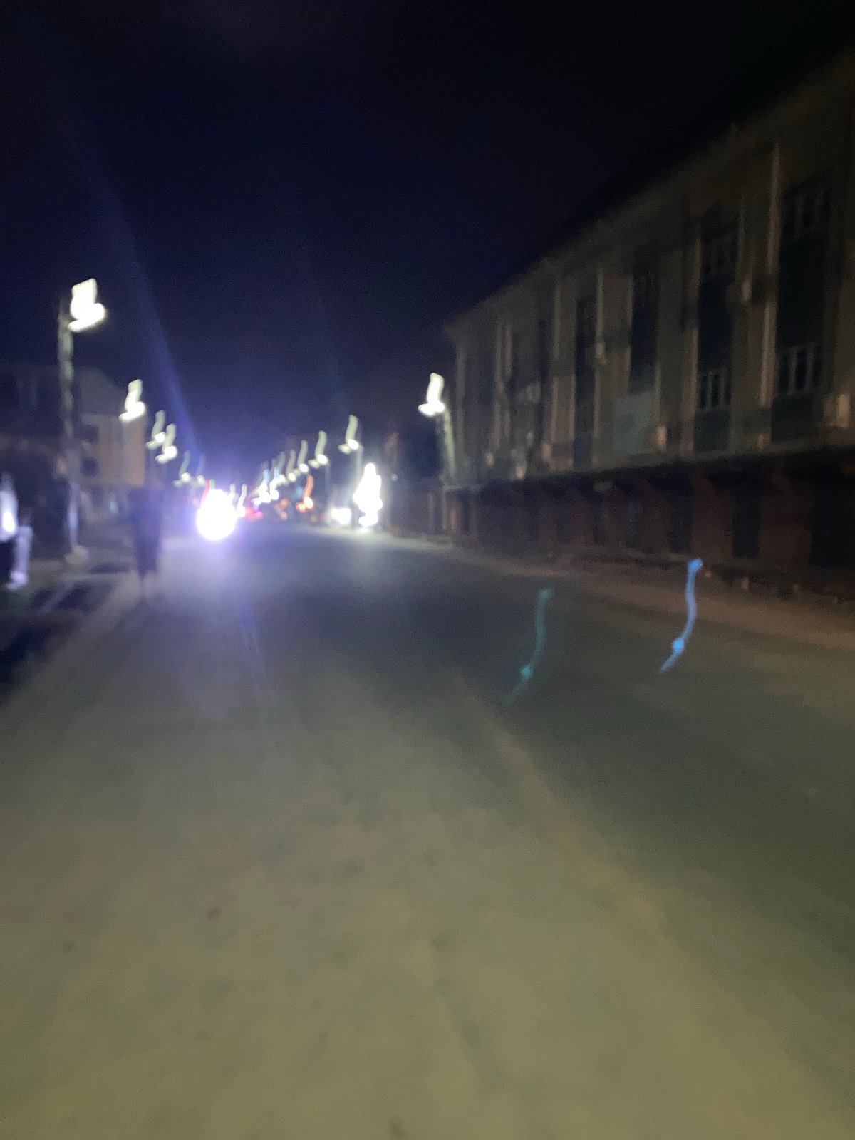 Nighttime street scene observed in Aba, Nigeria