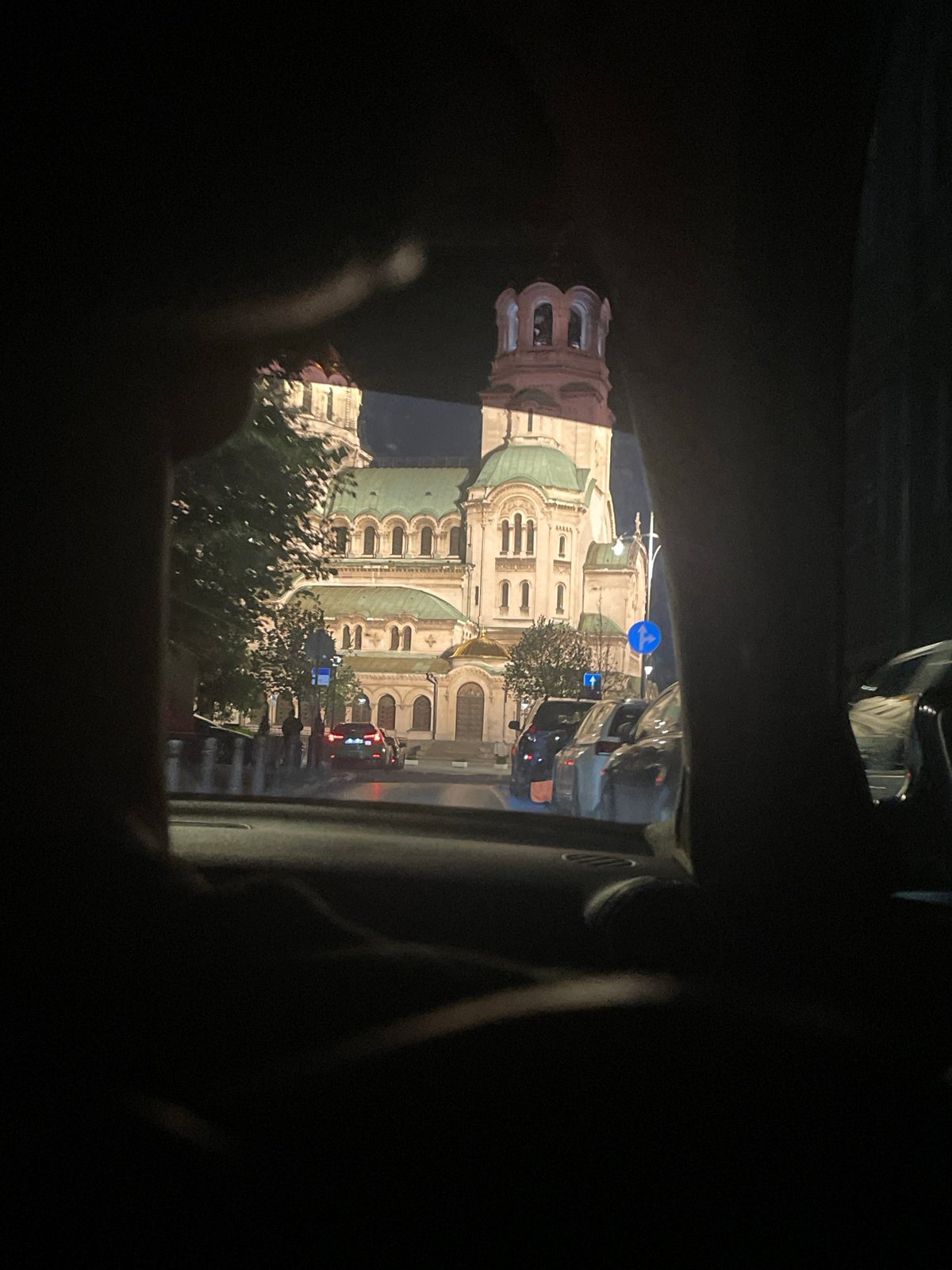 Nighttime drive past illuminated St. Alexander Nevsky Cathedral, Sofia