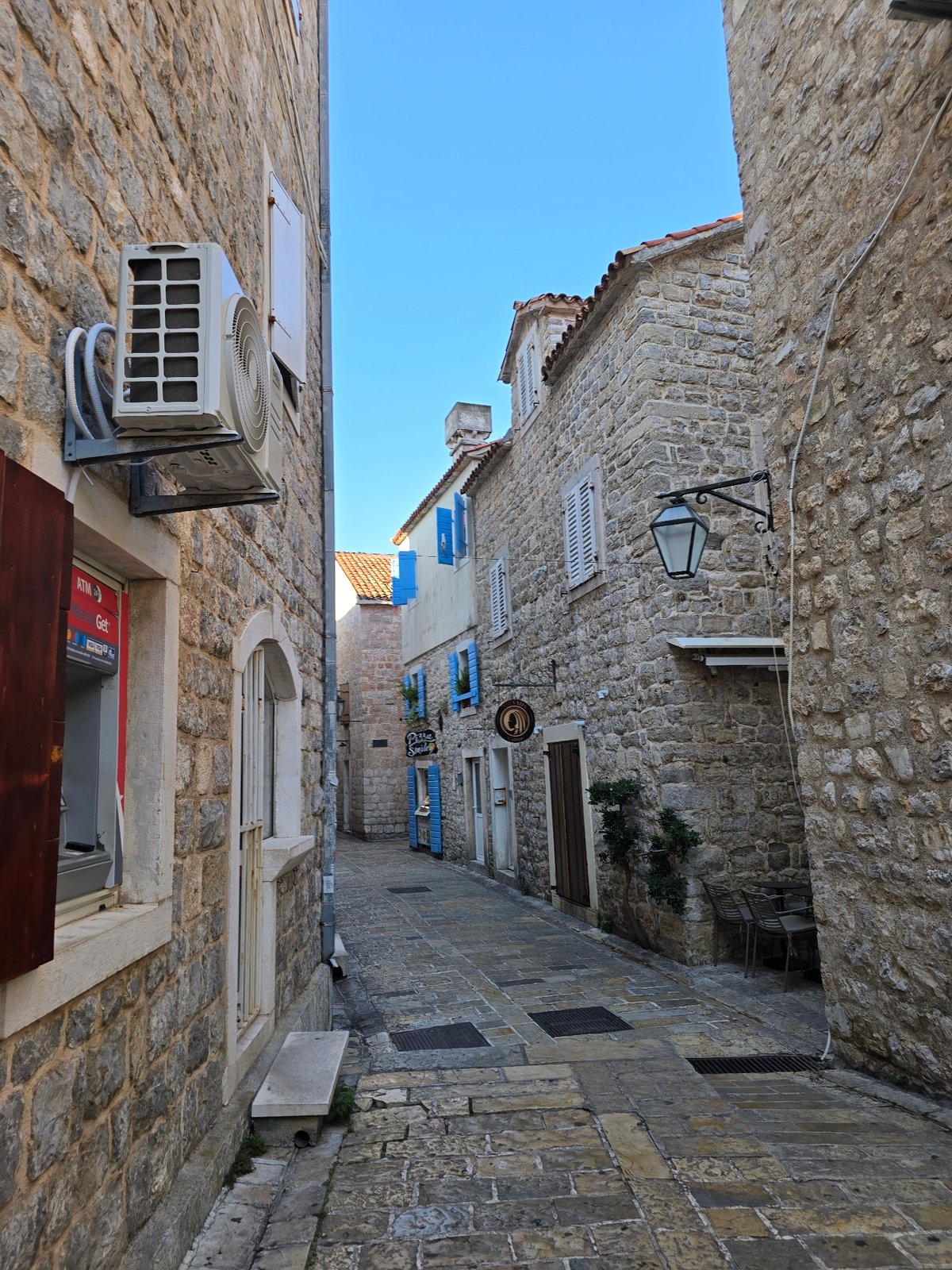Budva's Old Town alleys and yacht-lined marina on a summer morning