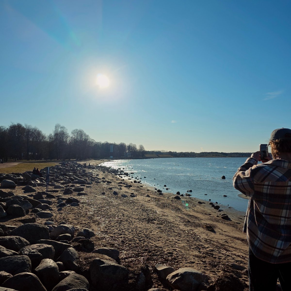 Afternoon visitors captured enjoying Peterhof waterfront areas