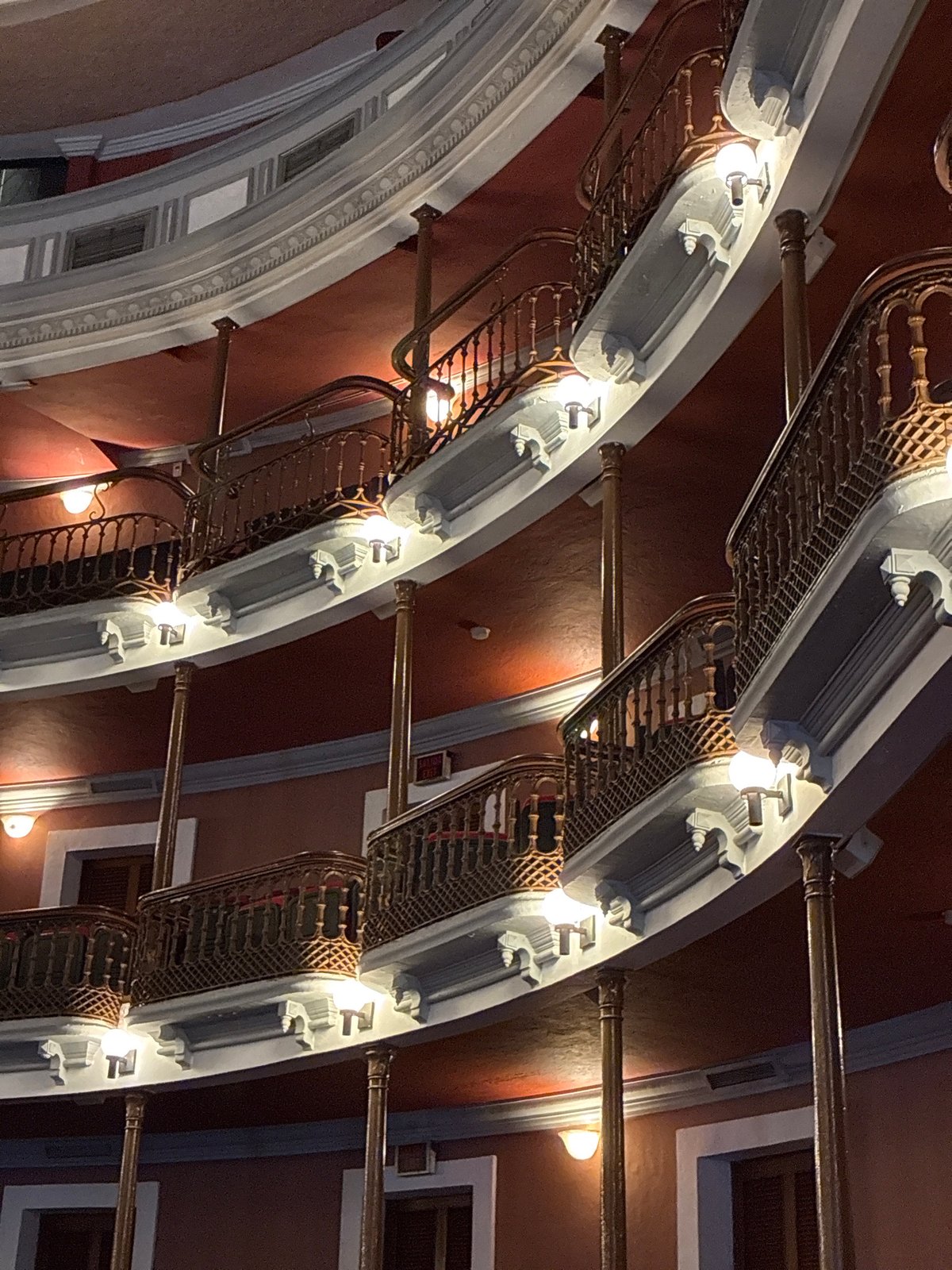Visitor documents historic architecture during afternoon walk in Mazatlán