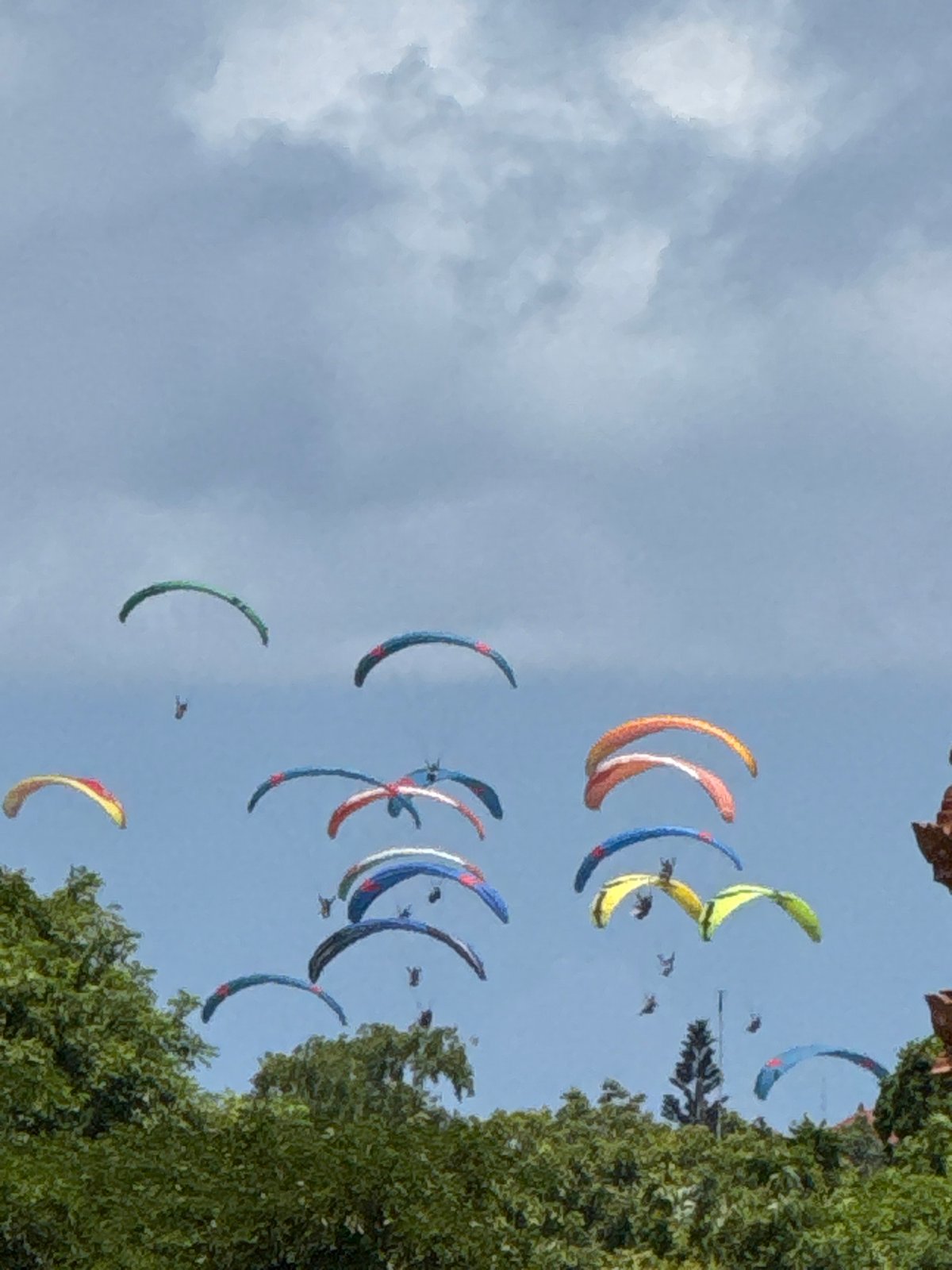 Multiple paragliders spotted in Indonesian skies amid clouds