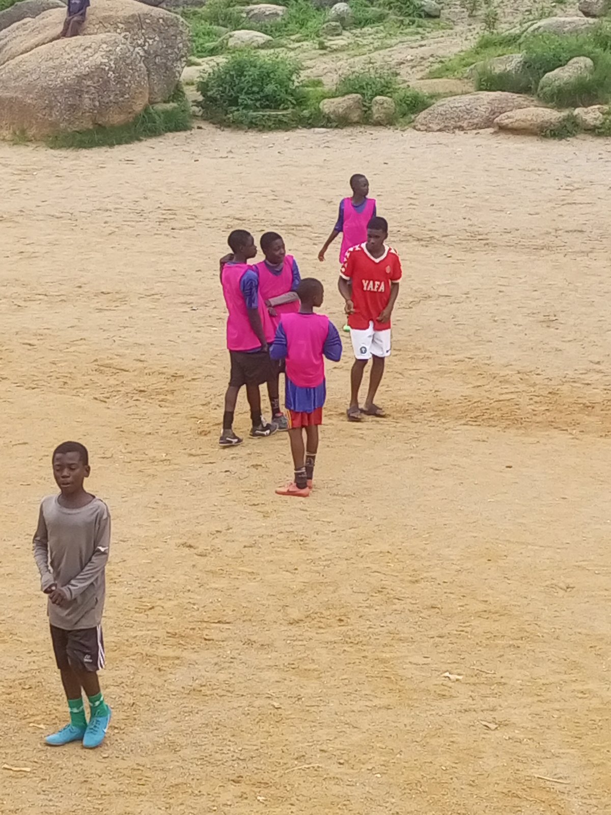 Youth football on the rocky fields of Jos, Nigeria