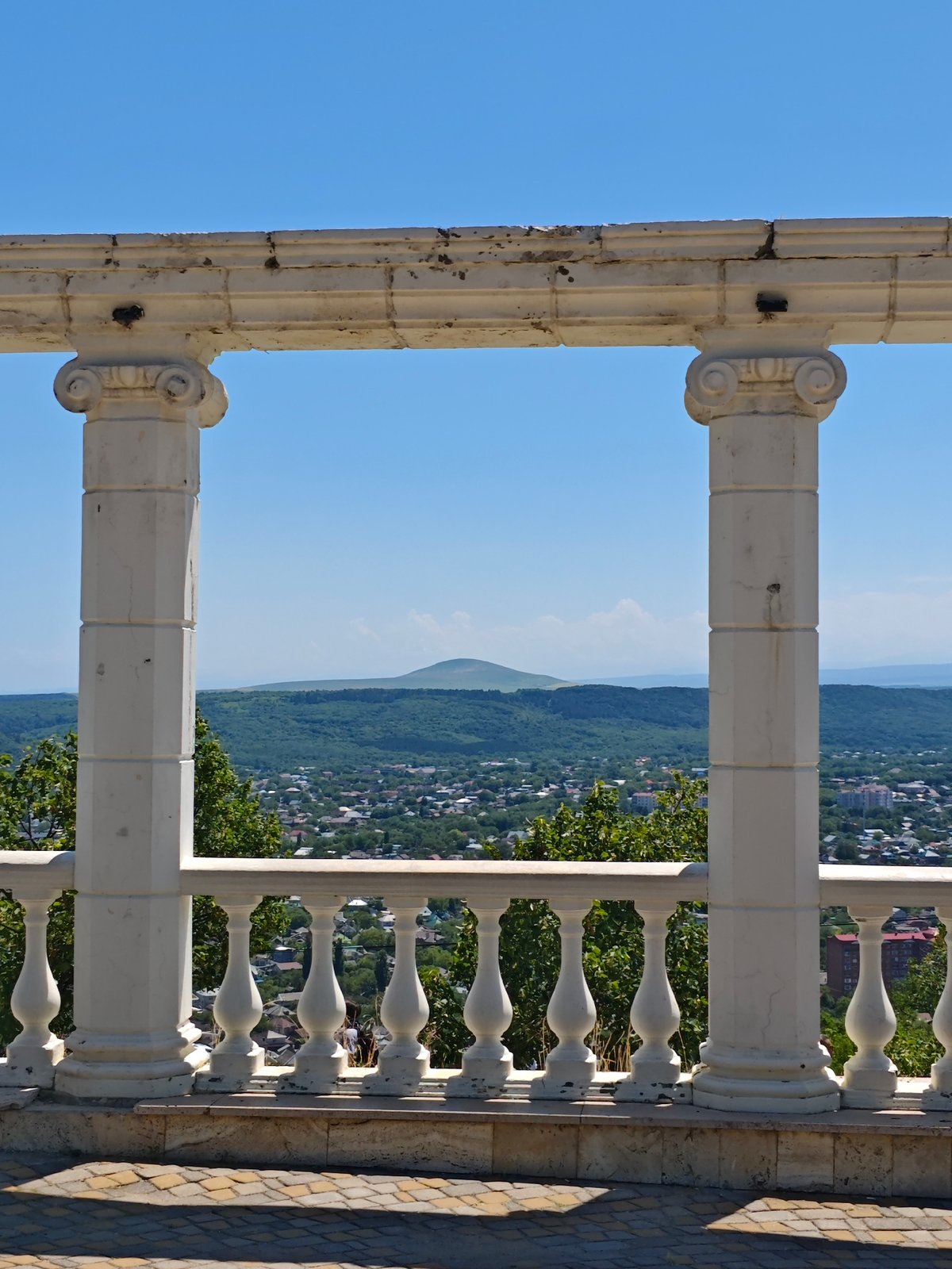 Classical colonnade overlook in Pyatigorsk with mountain backdrop