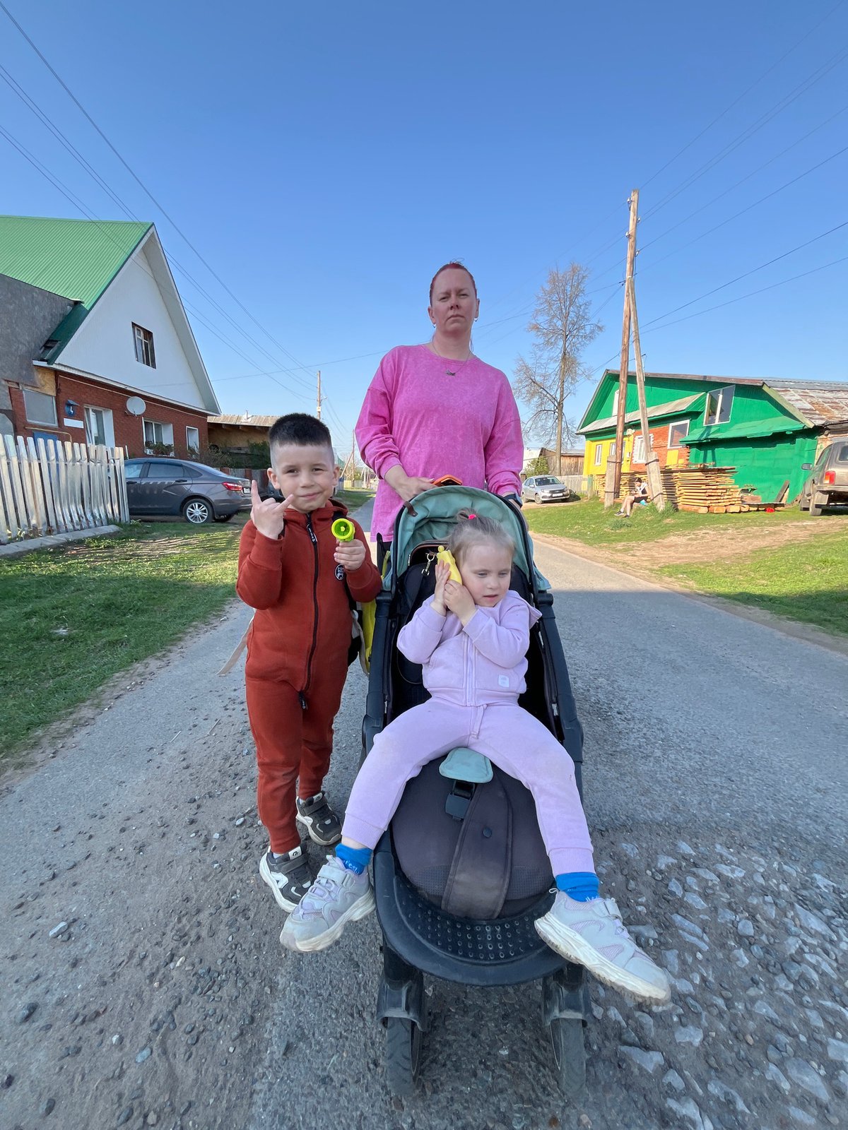 Family gathering observed on Chaikovsky street during afternoon