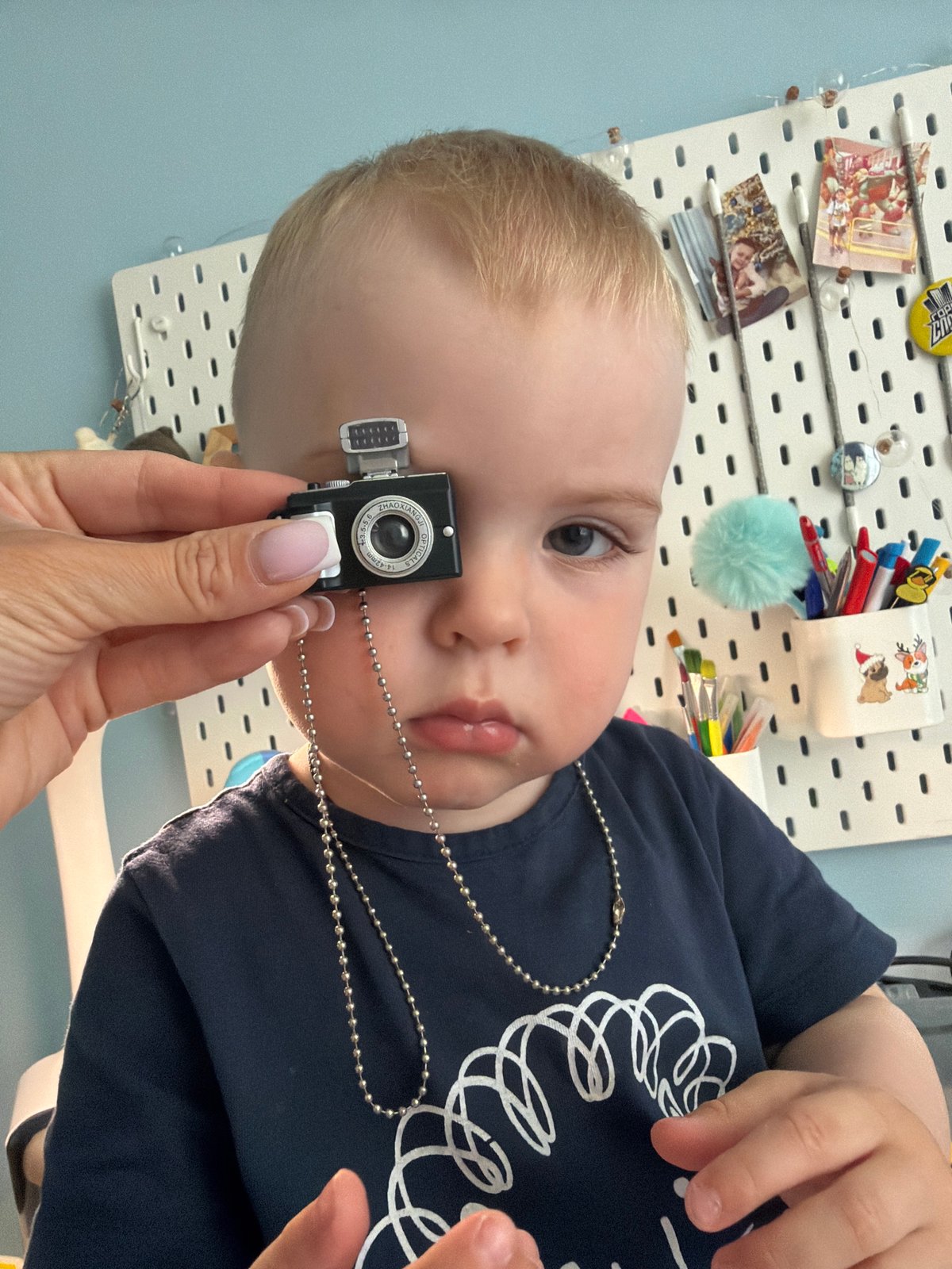Young child photographed during indoor moment in Votkinsk