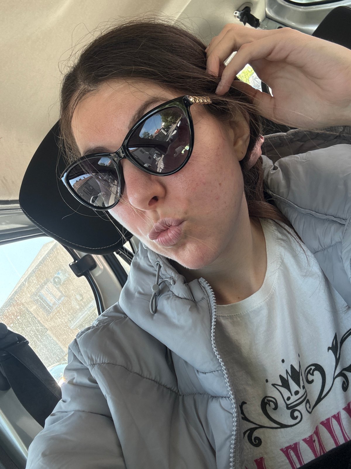 Woman observed in vehicle wearing casual winter attire