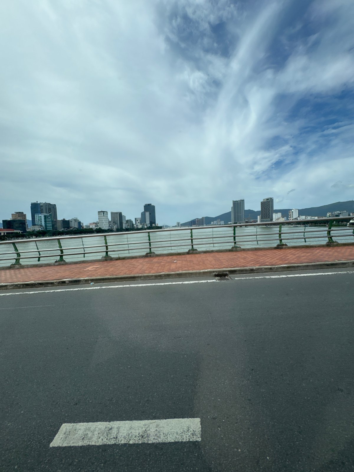 Crossing a yellow suspension bridge in Da Nang, Vietnam