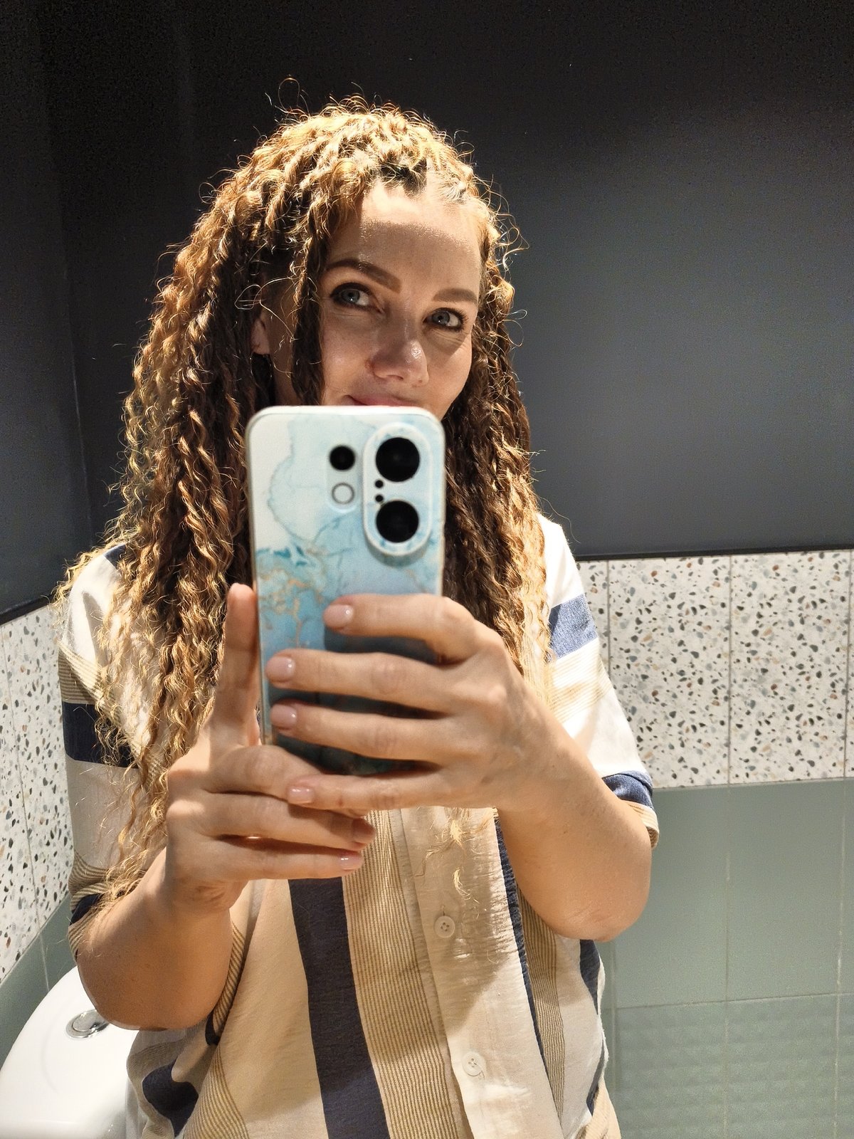 Woman in striped shirt photographed across multiple indoor locations