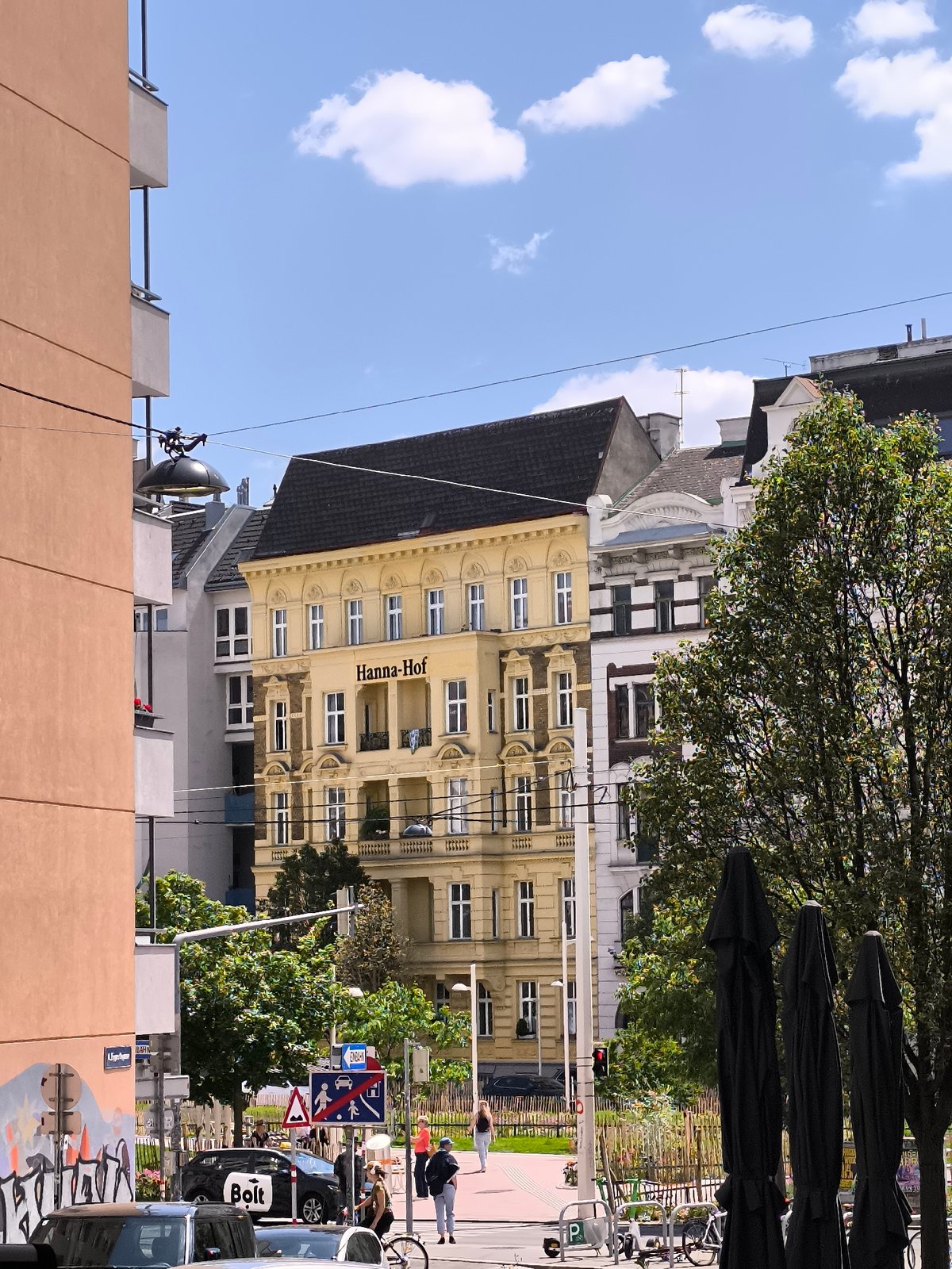Vienna street scene captured showing mixed architecture on sunny day
