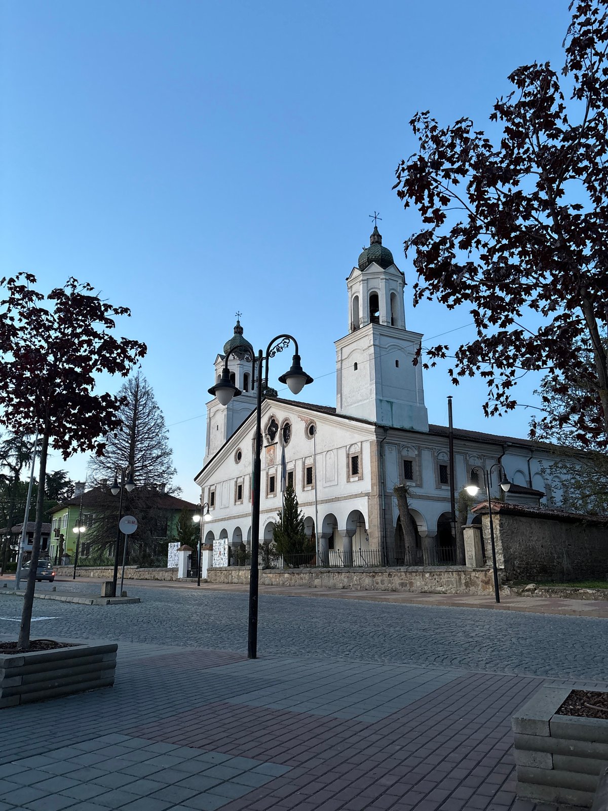 Evening stroll documented in Panagyurishte, Bulgaria near historic church