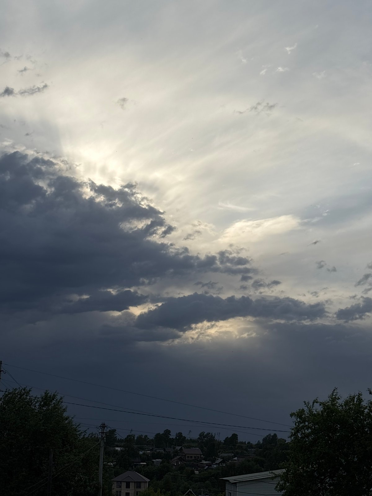 Woman photographed in Russian village as storm clouds gather