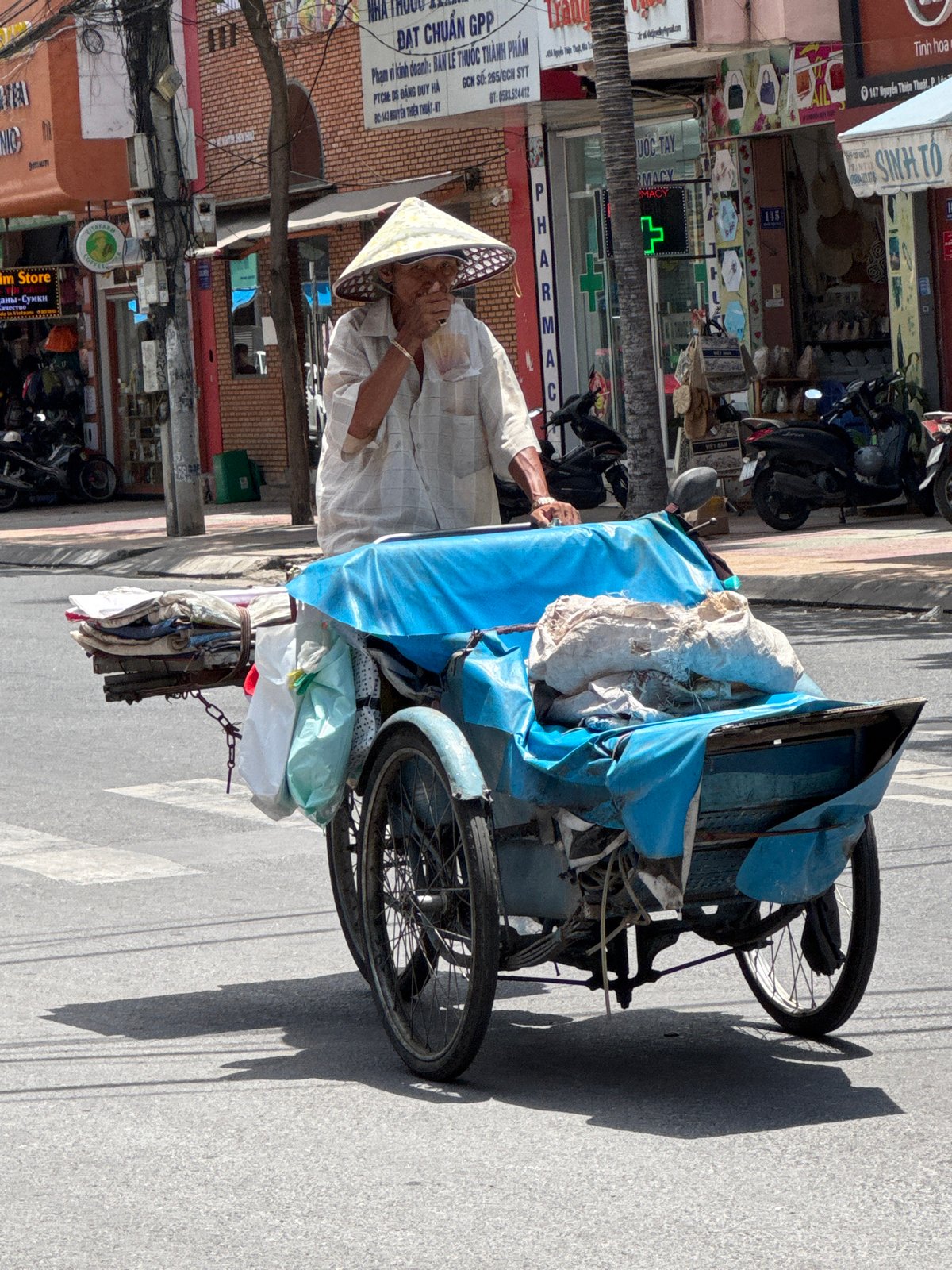 Everyday street life and vendors moving through Nha Trang