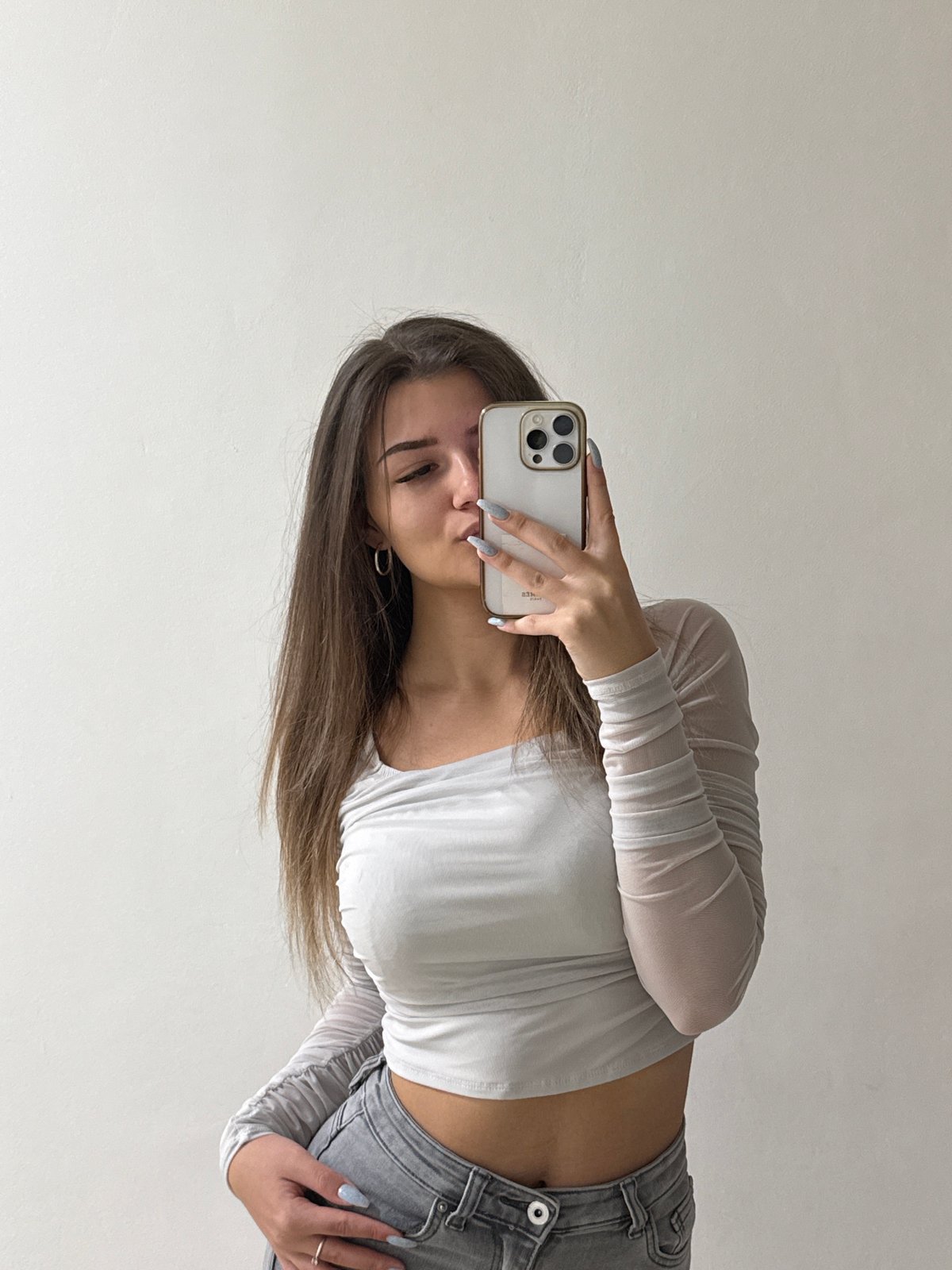 Woman takes selfies with dog in Sofia indoor setting