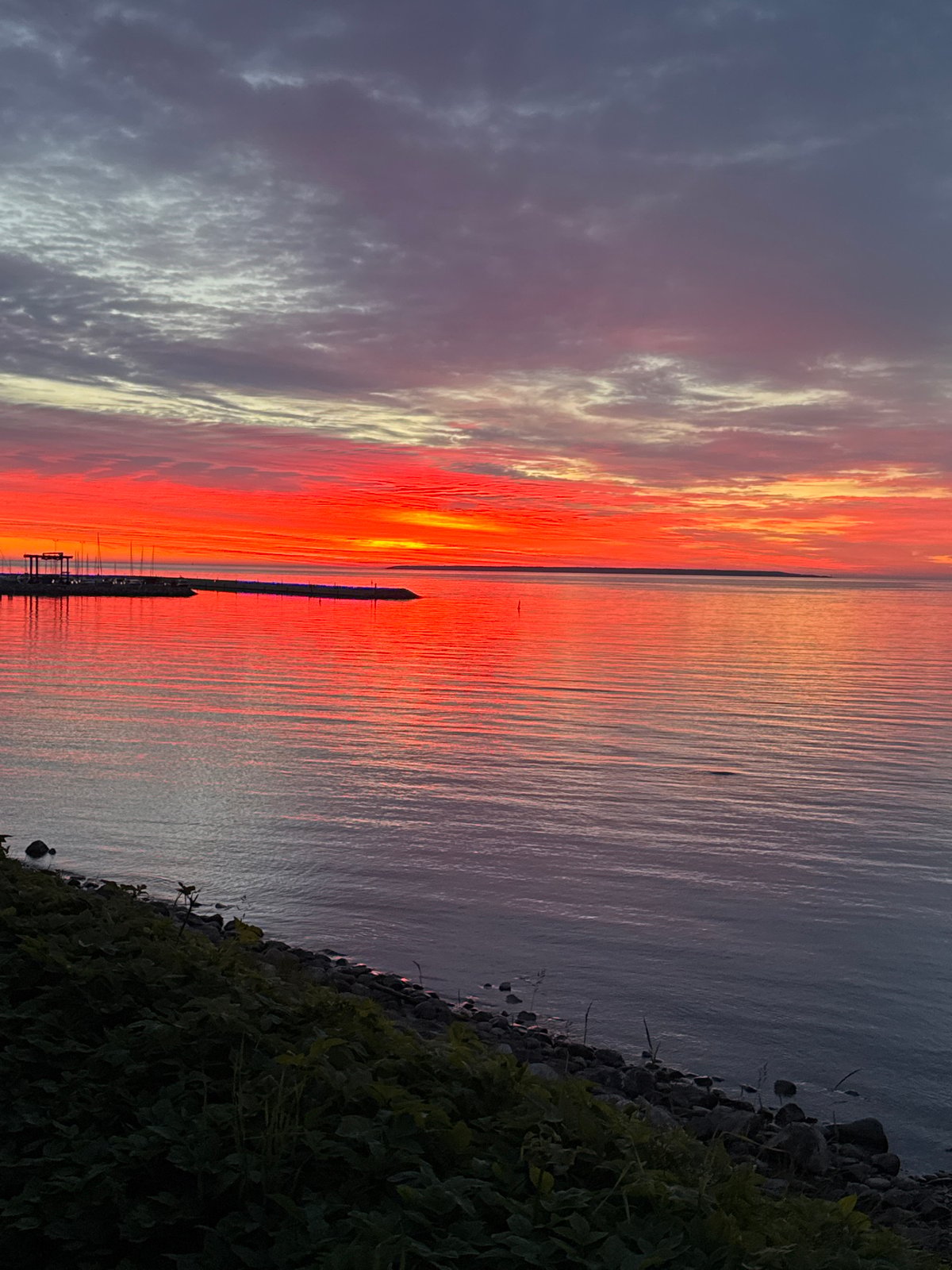 Dramatic sunset captivates Tallinn harbor visitors on summer evening