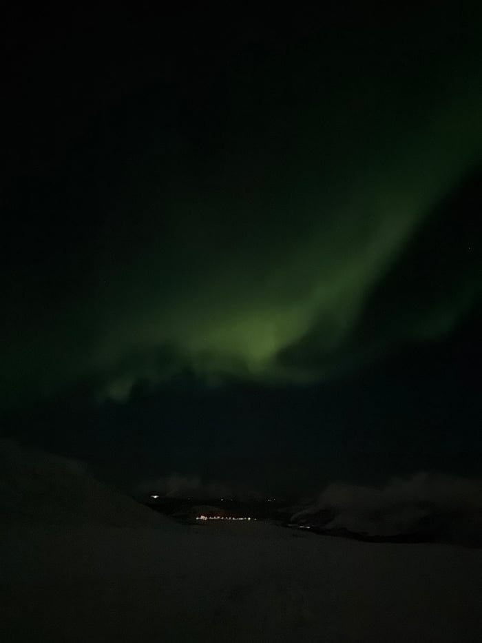 Aurora borealis displays captured over Tromsø from multiple perspectives
