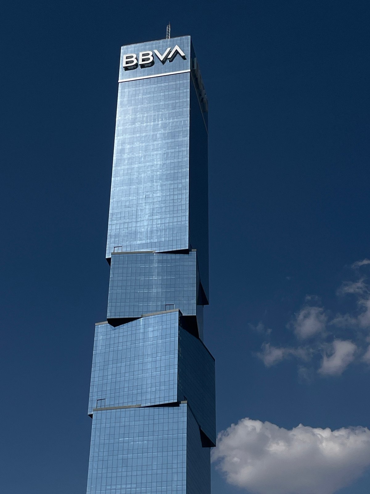Evening urban documentation captures tower, traffic, sculptures across city