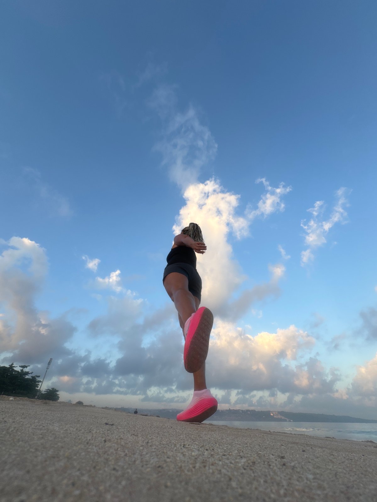 Beach sunset session in Kuta — movement, golden skies, Bali coast