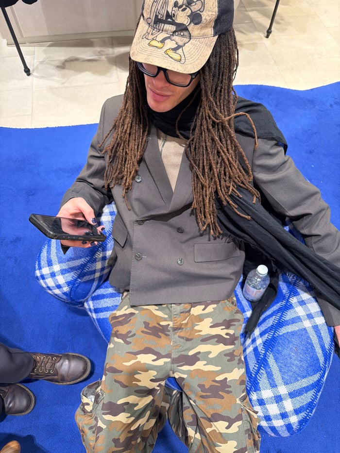 Dreadlocked individual's afternoon documented across Paris restaurants and streets