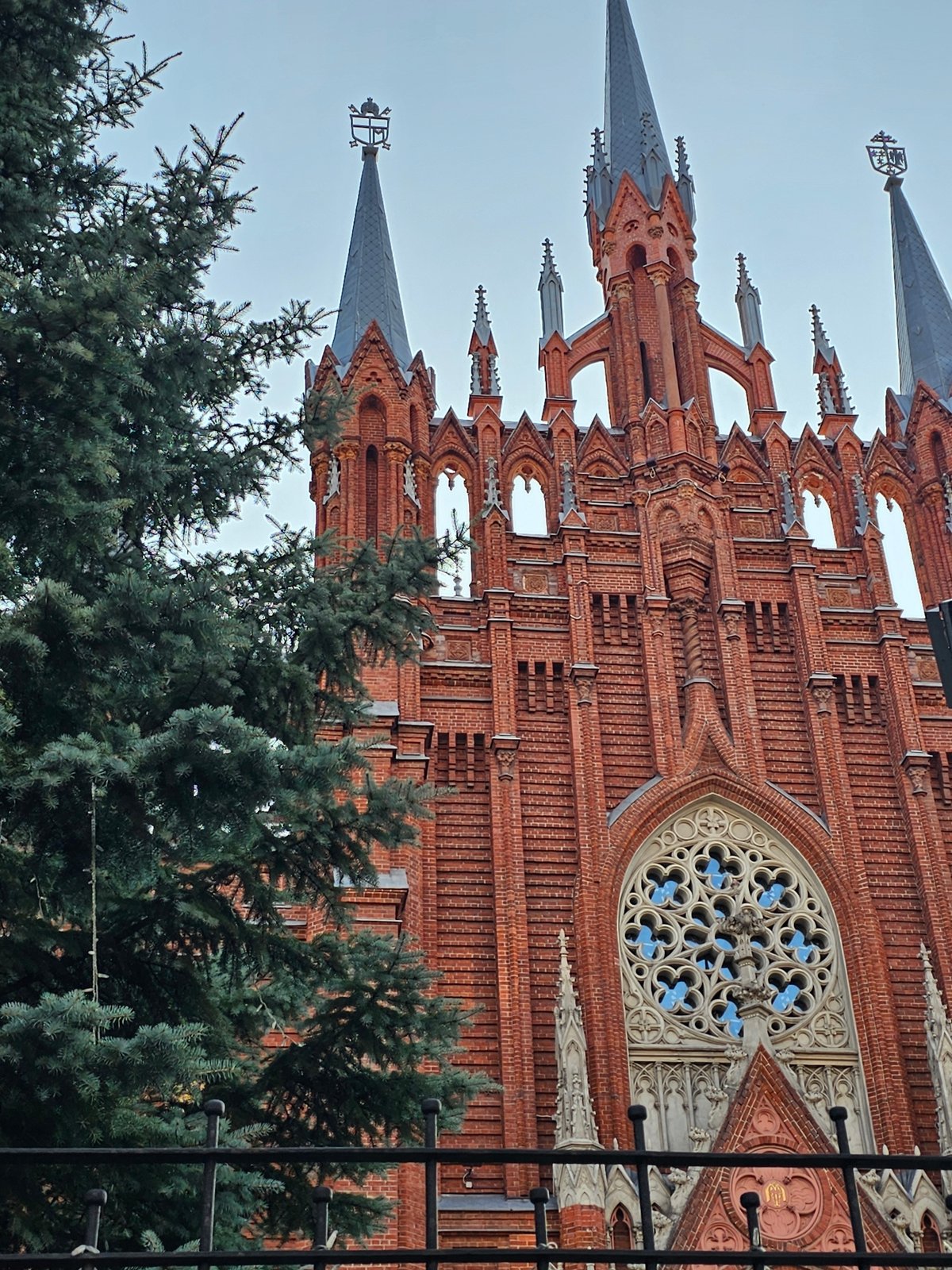 Moscow's Neo-Gothic Catholic cathedral and its ivy-covered neighbor