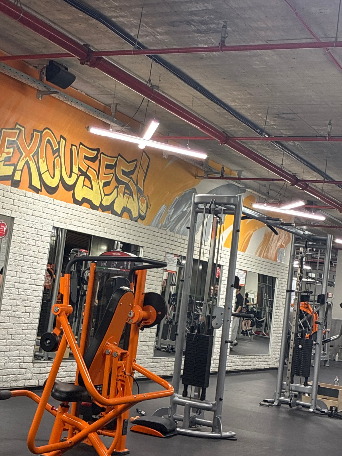 Plovdiv gym features 'EXCUSE' mural alongside fitness equipment