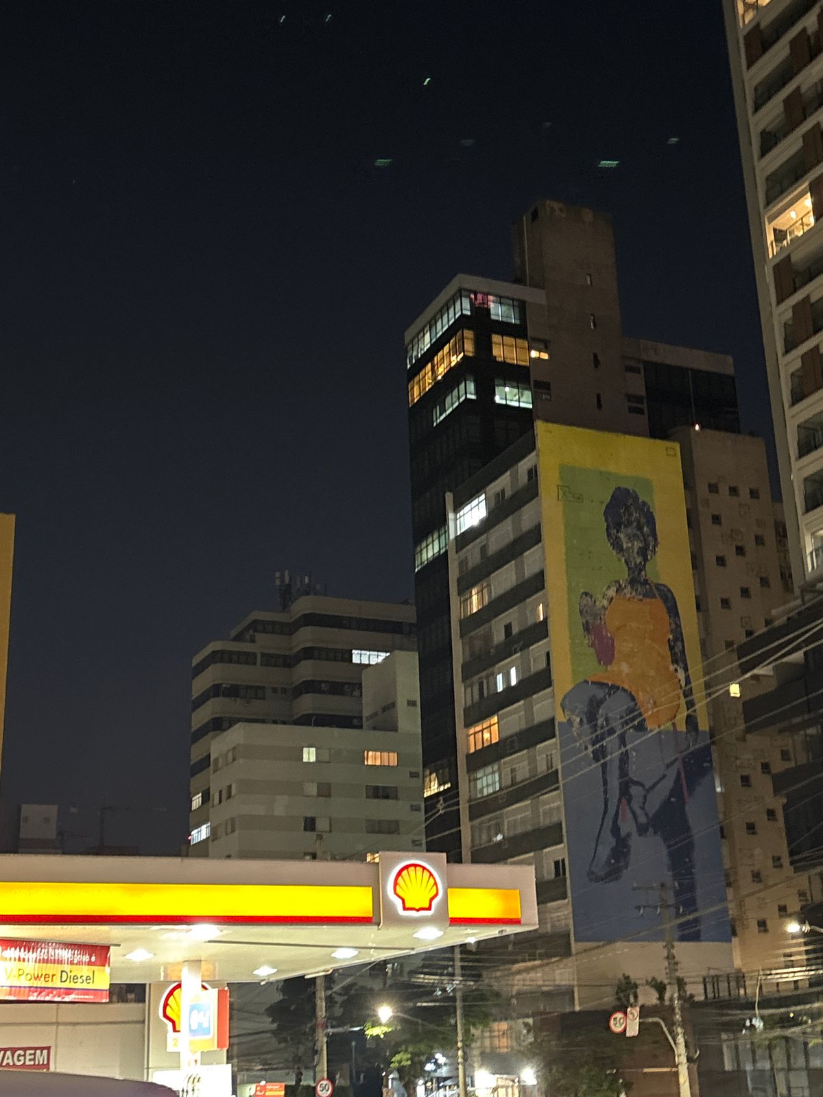 São Paulo night streets: gas stations, murals, and a bike shop