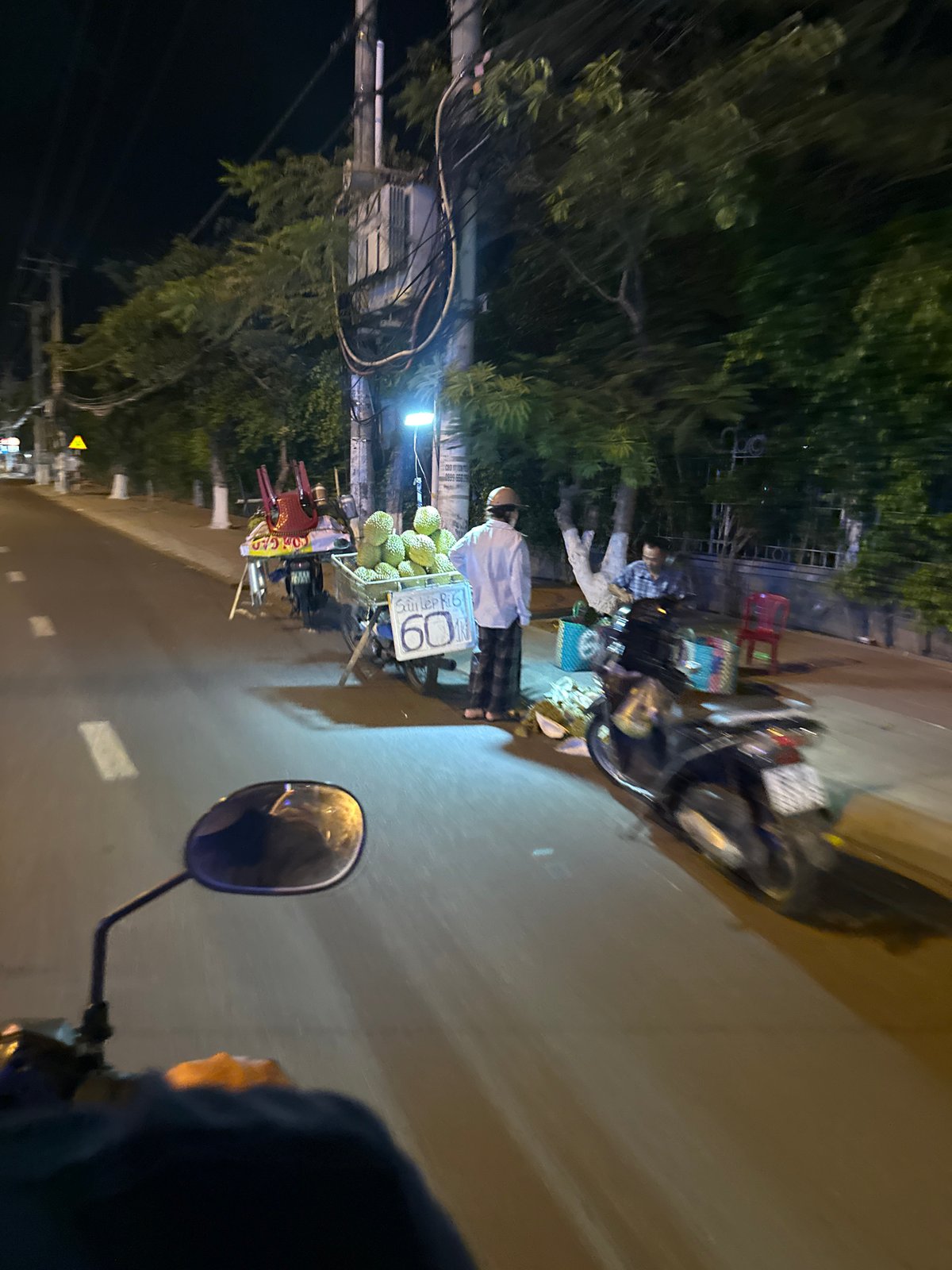Nighttime street scenes captured by motorbike rider in Vietnam