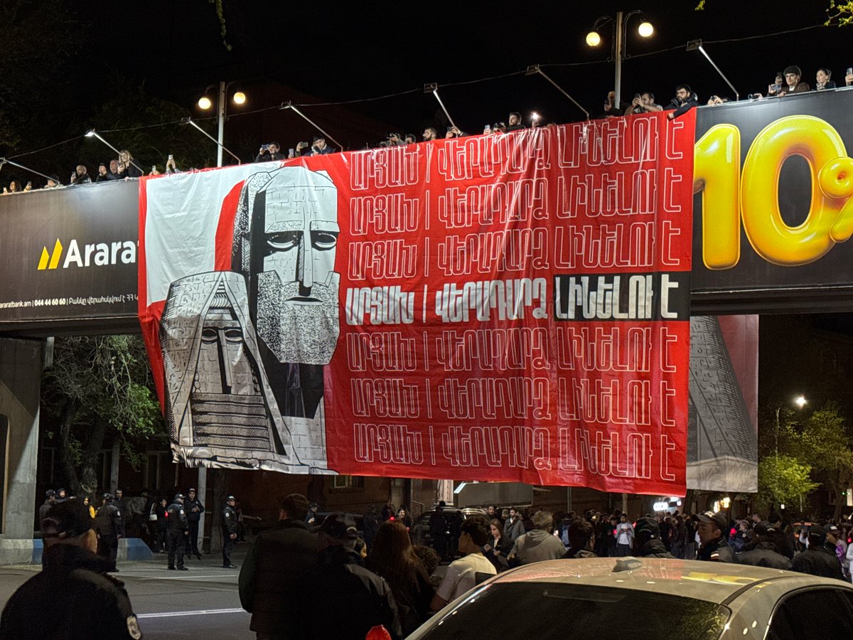 Red banner with white stripe displayed on Yerevan street