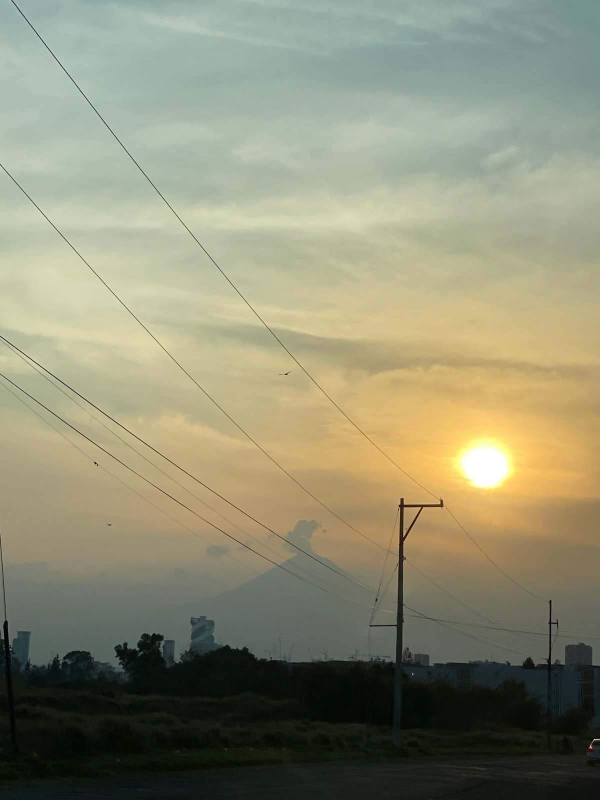 Cloudy skies with utility lines captured by witness