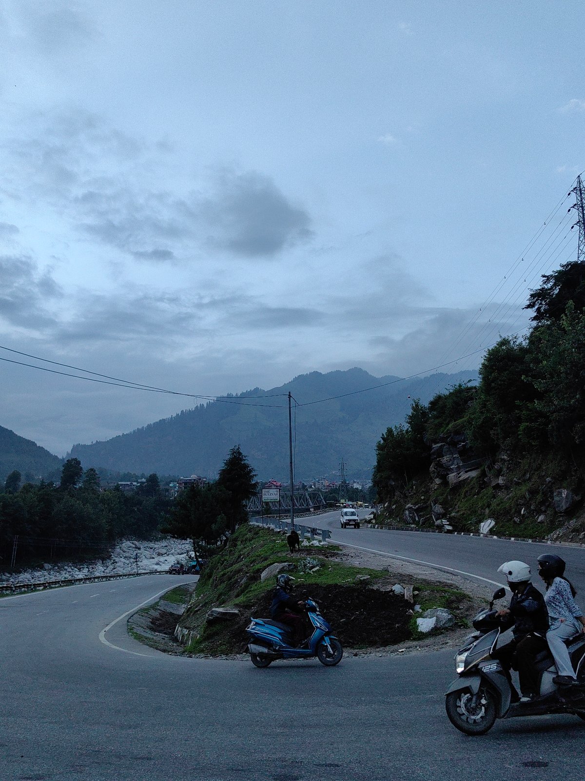 Mountain road construction and daily life in the Kullu hills
