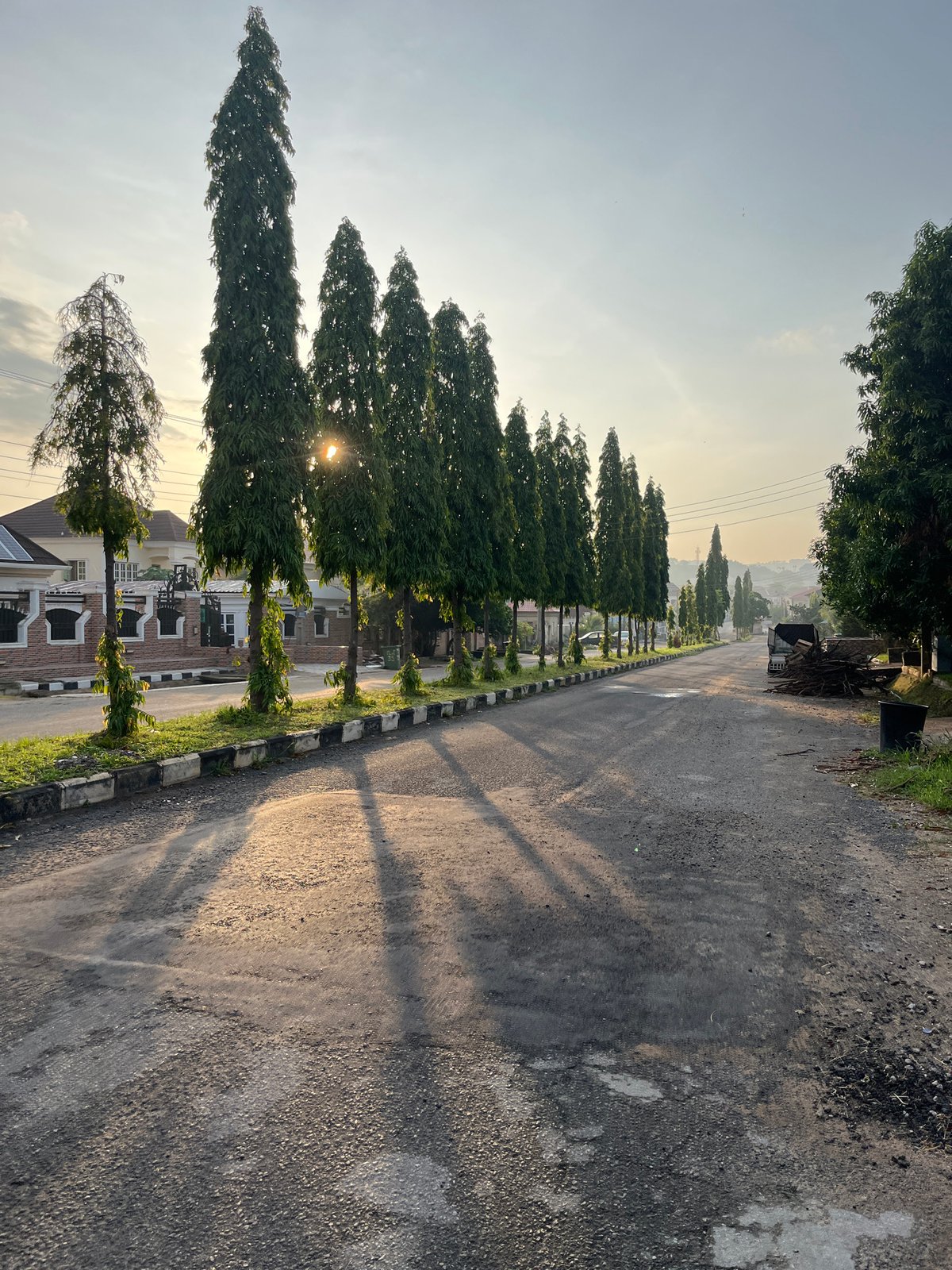 Morning life unfolds across Abuja neighborhoods during sunrise hours