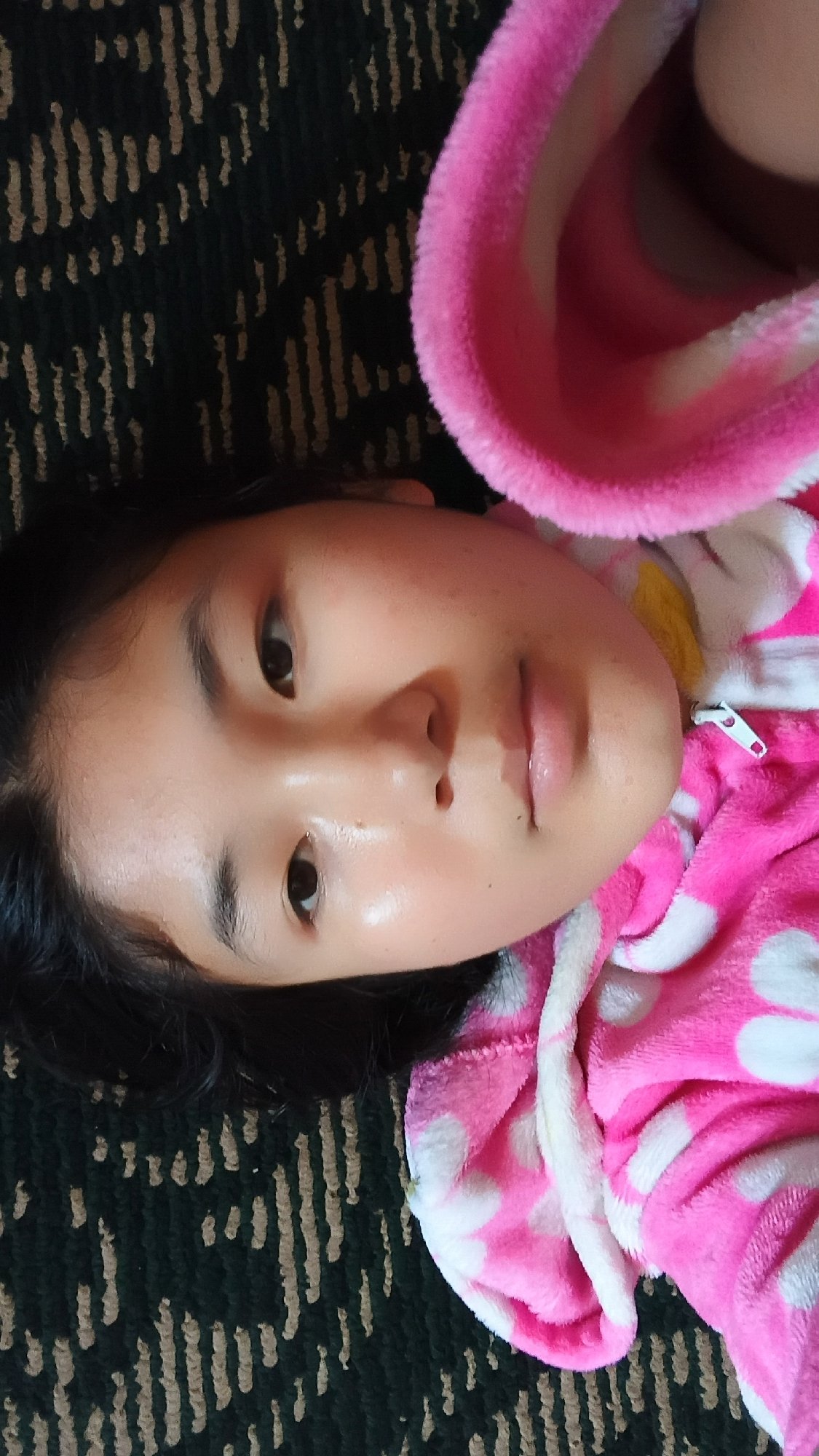 Close-up in Uchkun: pink polka-dot jacket, lying down